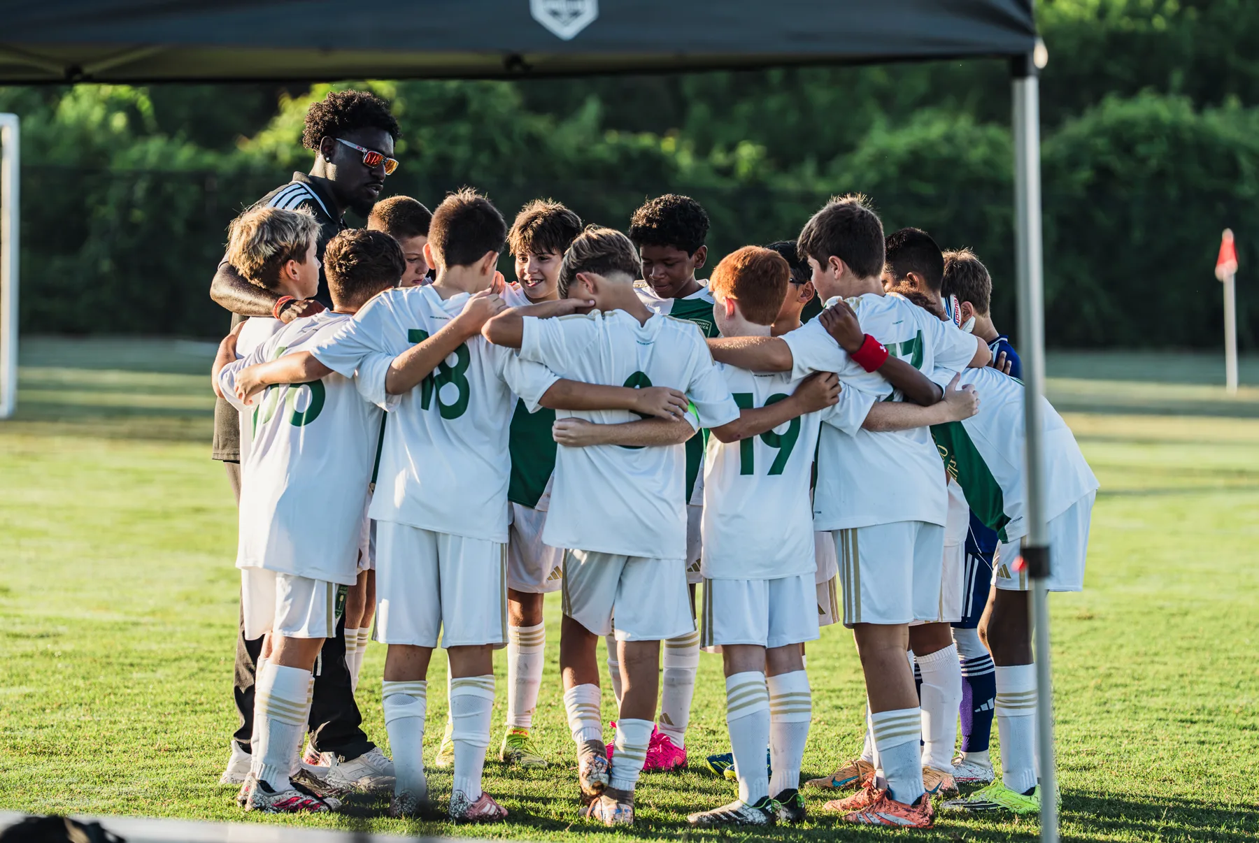 Youth soccer team in a pre-match huddle